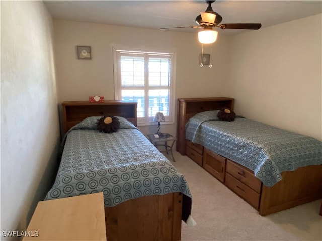 bedroom featuring ceiling fan and light colored carpet