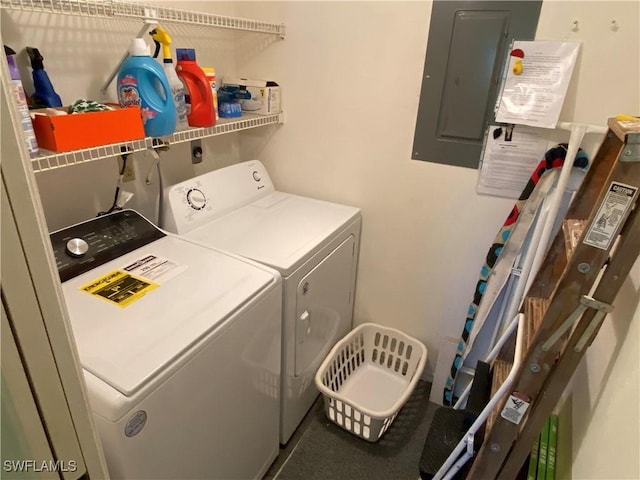 washroom featuring electric panel and separate washer and dryer