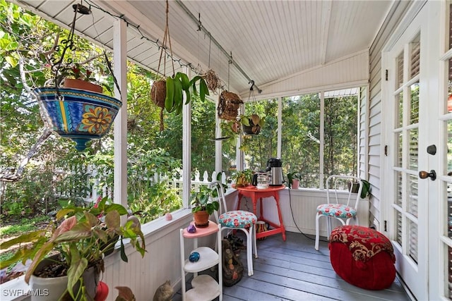 sunroom / solarium with vaulted ceiling