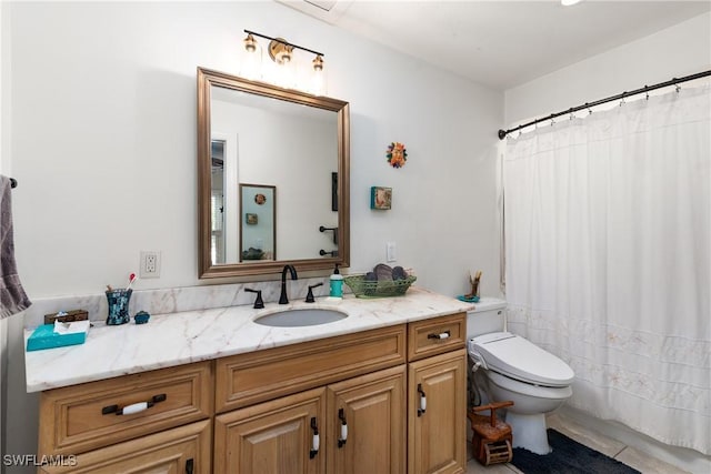 bathroom featuring vanity and toilet