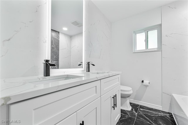 bathroom with vanity, toilet, and a bathing tub