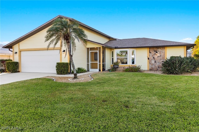 single story home featuring a front lawn and a garage