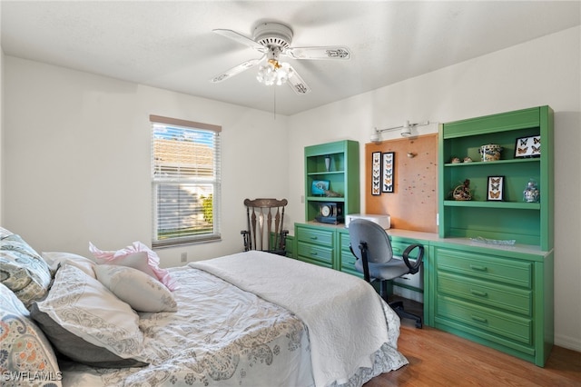 bedroom featuring hardwood / wood-style flooring and ceiling fan