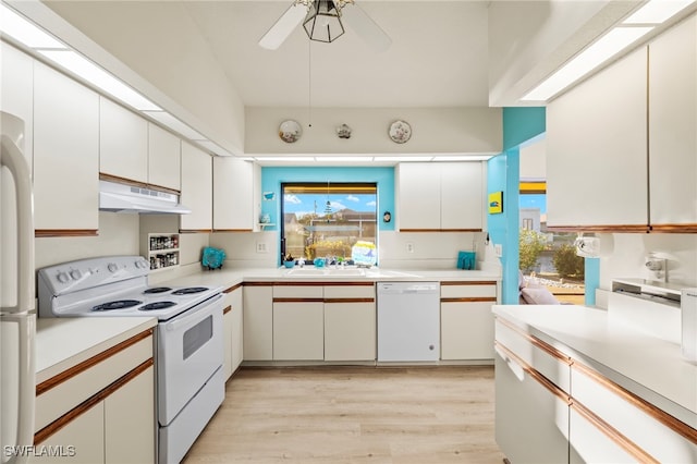 kitchen with white appliances, sink, ceiling fan, light wood-type flooring, and white cabinetry