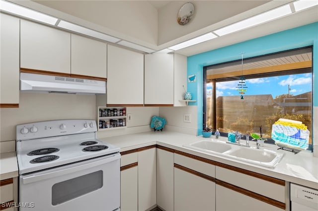 kitchen with white cabinets, white appliances, and sink