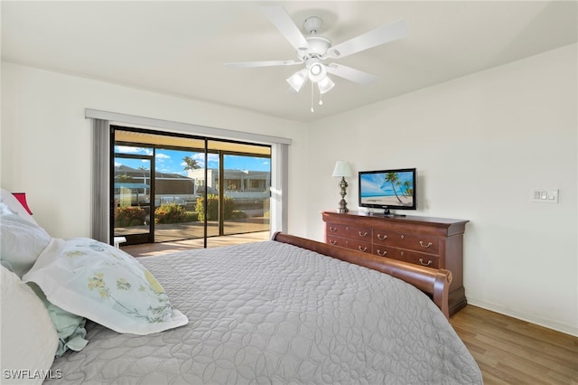 bedroom featuring access to outside, light hardwood / wood-style flooring, and ceiling fan