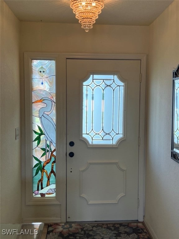 entrance foyer featuring a chandelier