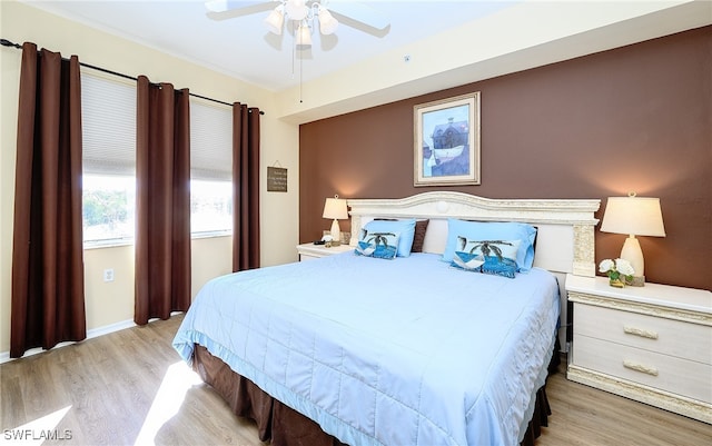 bedroom featuring light wood-type flooring and ceiling fan