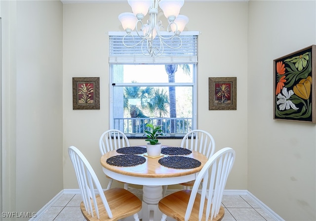 tiled dining space with an inviting chandelier