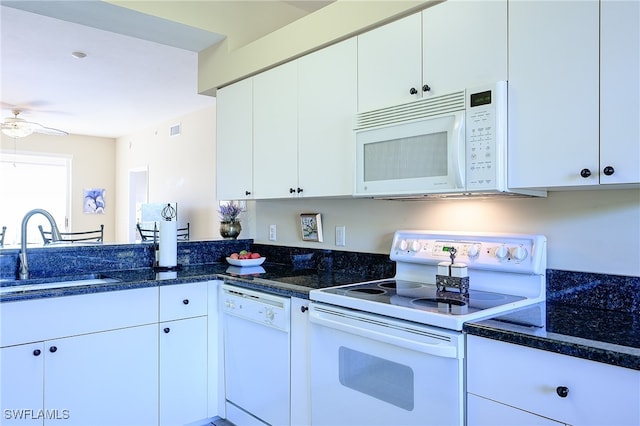 kitchen with white appliances, white cabinetry, ceiling fan, and sink