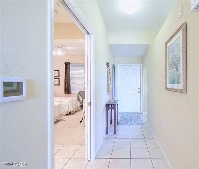 corridor featuring light tile patterned floors