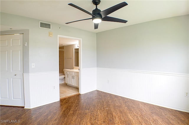 empty room with ceiling fan and wood-type flooring