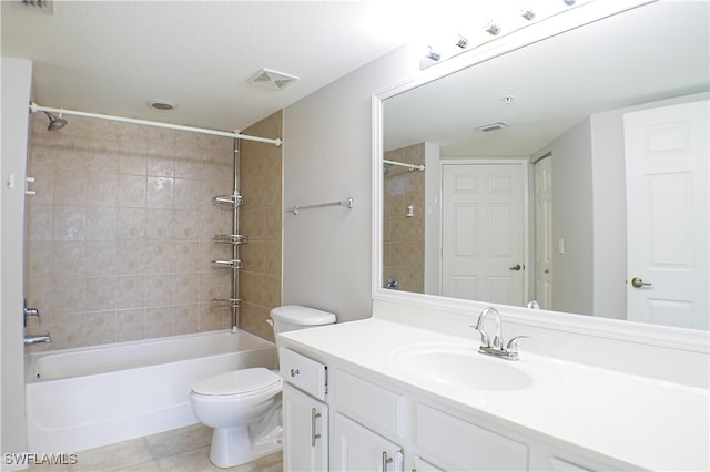 full bathroom with toilet, vanity, tiled shower / bath combo, and tile patterned floors