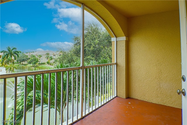 balcony featuring a water view