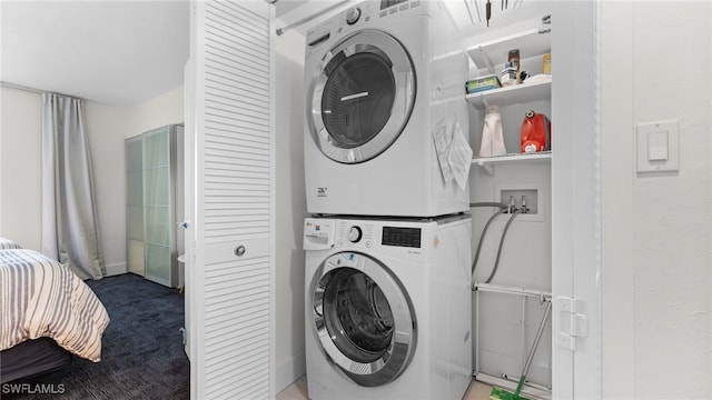 washroom with stacked washer / dryer