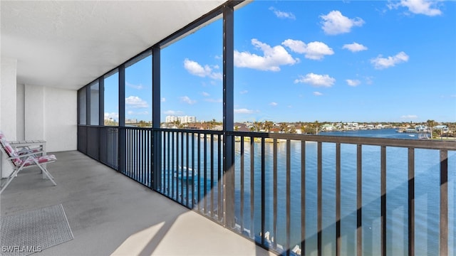 unfurnished sunroom with a water view