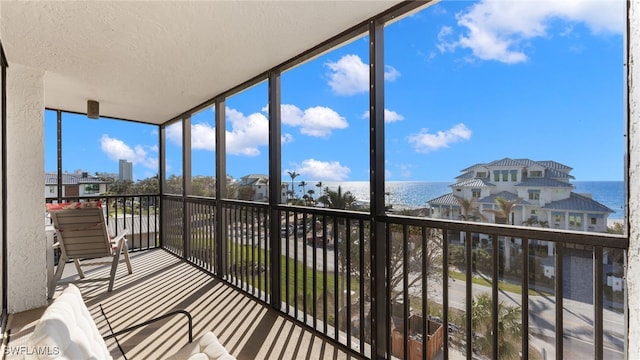 sunroom with a water view