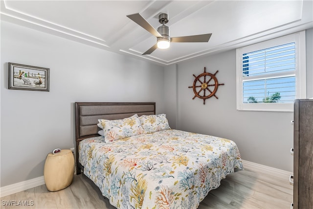 bedroom featuring ceiling fan and light hardwood / wood-style flooring