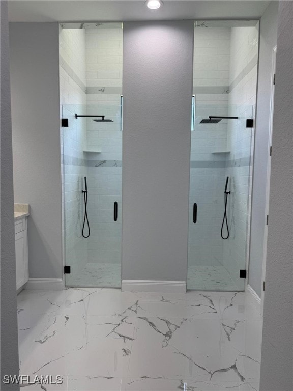 5028 Billings St, Lehigh Acres, FL 33971 - bathroom featuring a shower stall, baseboards, vanity, marble finish flooring, and recessed lighting