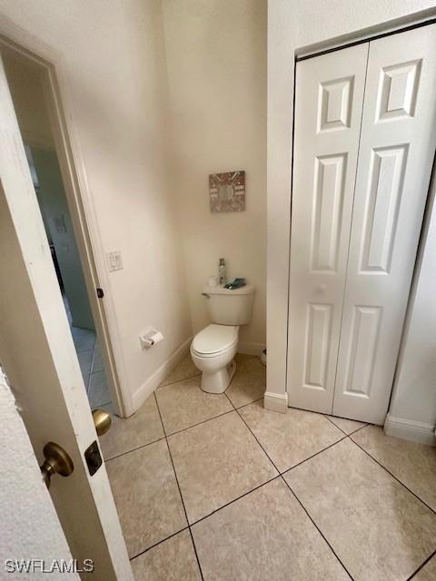 bathroom featuring tile patterned floors and toilet