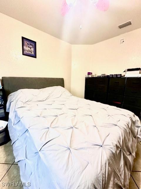 bedroom with tile patterned floors