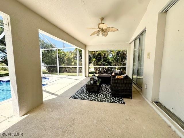 sunroom / solarium with ceiling fan and a pool