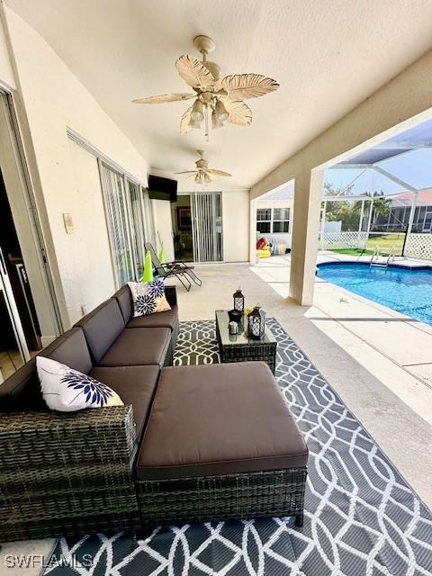 view of patio / terrace featuring glass enclosure and outdoor lounge area