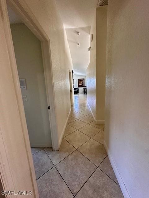 hallway with light tile patterned floors