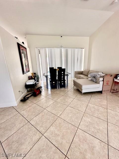 unfurnished living room with light tile patterned floors