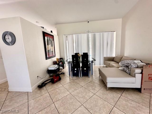 living room with light tile patterned floors