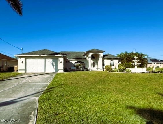 ranch-style house featuring a front lawn and a garage