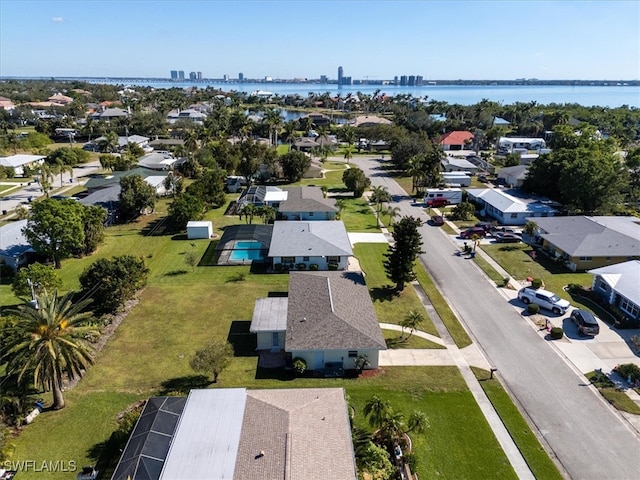 birds eye view of property with a water view