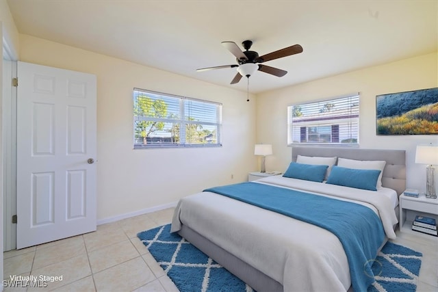 tiled bedroom with ceiling fan