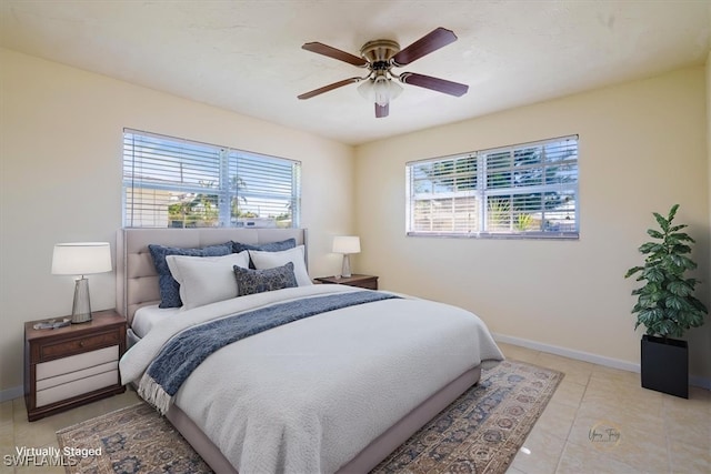 tiled bedroom with ceiling fan