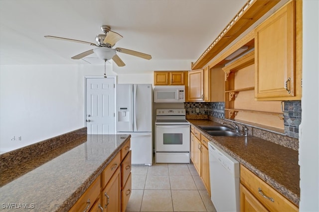 kitchen with white appliances, sink, ceiling fan, decorative backsplash, and light tile patterned floors