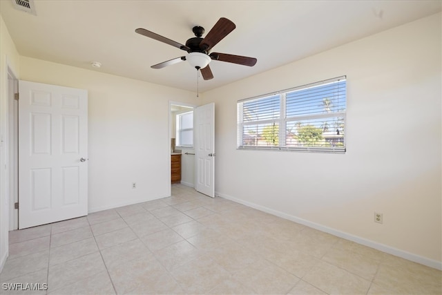 unfurnished bedroom featuring ceiling fan and light tile patterned flooring