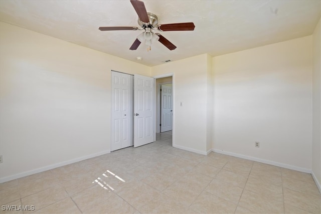 interior space featuring ceiling fan and light tile patterned flooring