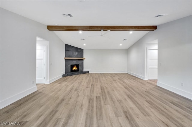 381 Norwood Ct, Fort Myers, FL 33919 - unfurnished living room featuring light wood finished floors, baseboards, a tiled fireplace, a ceiling fan, and recessed lighting