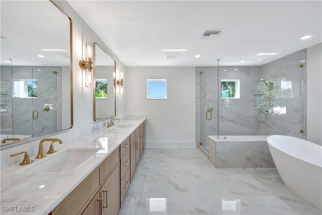 381 Norwood Ct, Fort Myers, FL 33919 - full bathroom featuring a freestanding bath, double vanity, a marble finish shower, marble tiled flooring, and recessed lighting