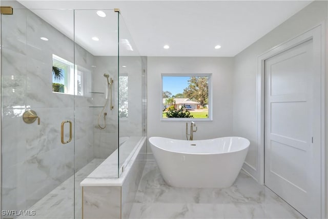 381 Norwood Ct, Fort Myers, FL 33919 - bathroom with marble tiled flooring, a freestanding bath, a marble finish shower, and recessed lighting