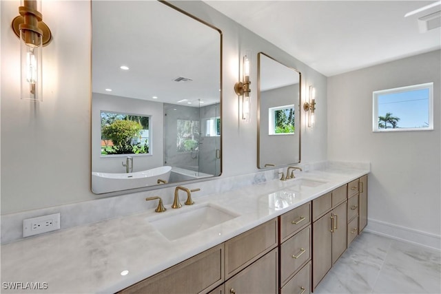 381 Norwood Ct, Fort Myers, FL 33919 - full bathroom featuring marble finish floors, double vanity, plenty of natural light, a freestanding tub, and recessed lighting