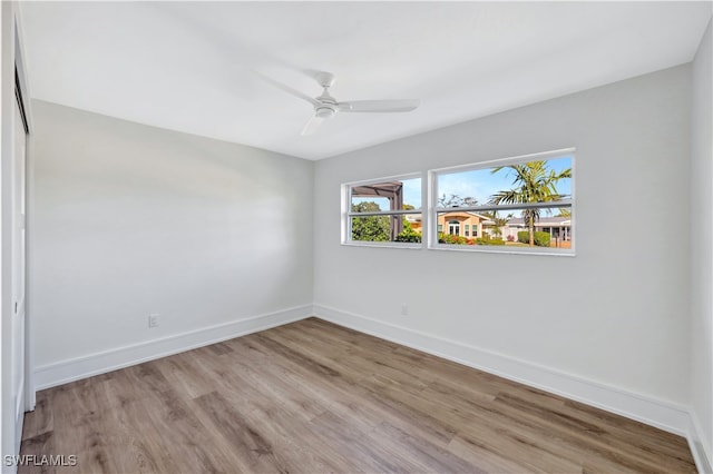 empty room featuring ceiling fan and light hardwood / wood-style floors