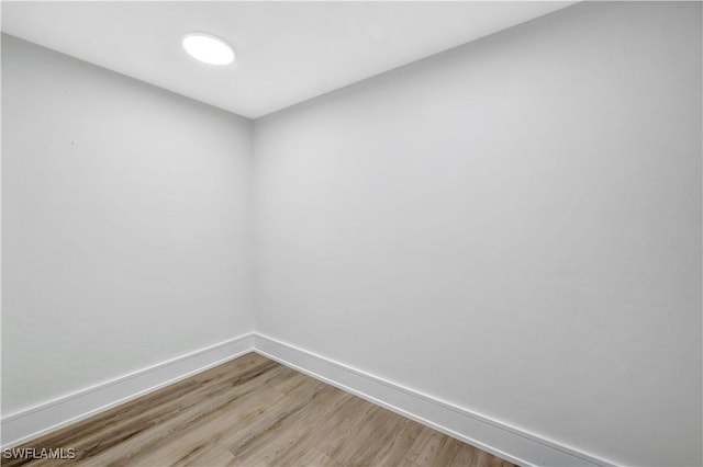 381 Norwood Ct, Fort Myers, FL 33919 - spare room with baseboards and wood finished floors