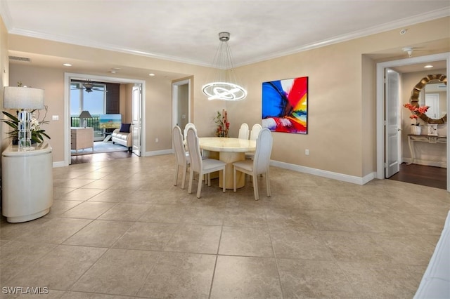 tiled dining area with ceiling fan with notable chandelier and ornamental molding