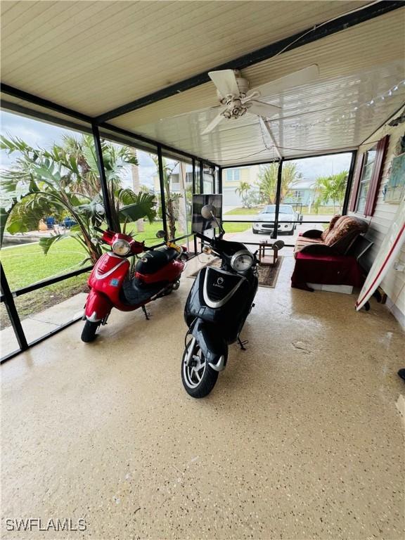 sunroom / solarium with ceiling fan