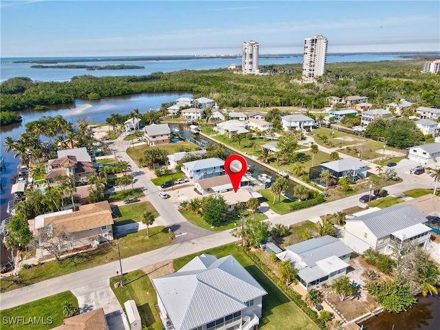 birds eye view of property featuring a water view