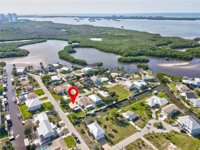 birds eye view of property featuring a water view