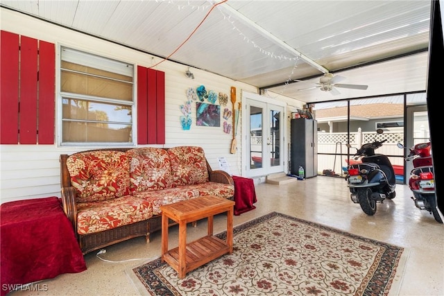 sunroom / solarium with ceiling fan and french doors