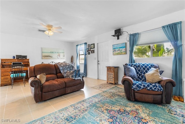 living room featuring ceiling fan and light tile patterned flooring