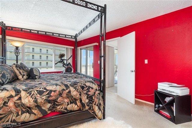 carpeted bedroom with a textured ceiling